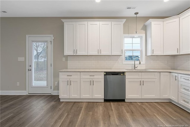 kitchen with dishwasher, hanging light fixtures, plenty of natural light, and sink