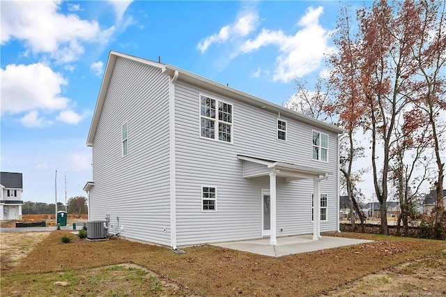 back of house with a patio and central AC unit