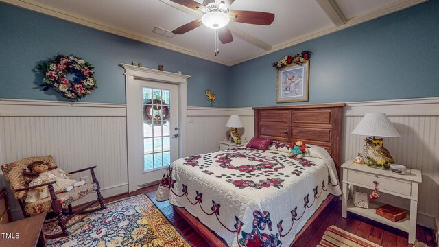 bedroom featuring ornamental molding, ceiling fan, and dark wood-type flooring