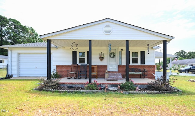 view of front facade with a garage, a front yard, and a porch