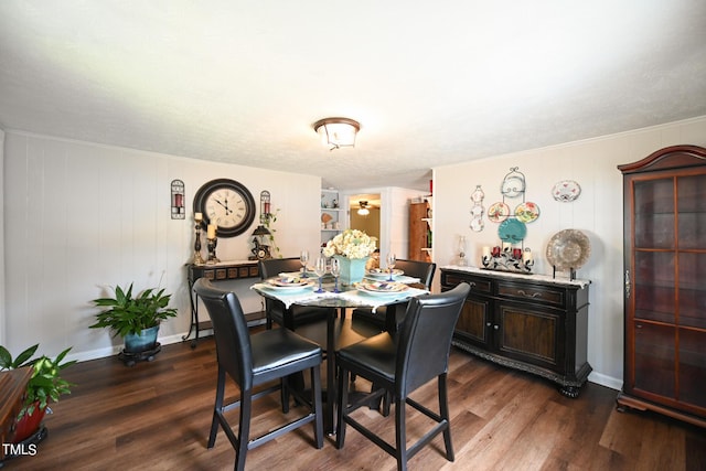 dining space with dark hardwood / wood-style flooring