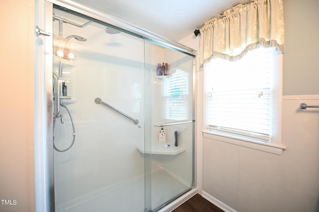 bathroom featuring an enclosed shower