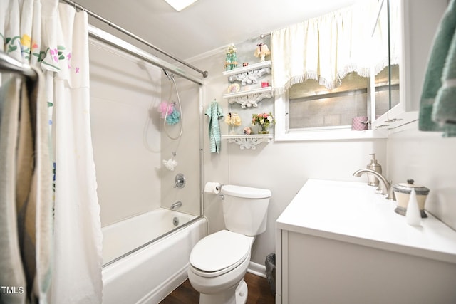 full bathroom with vanity, toilet, and shower / tub combo with curtain