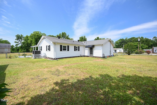 back of house with a yard