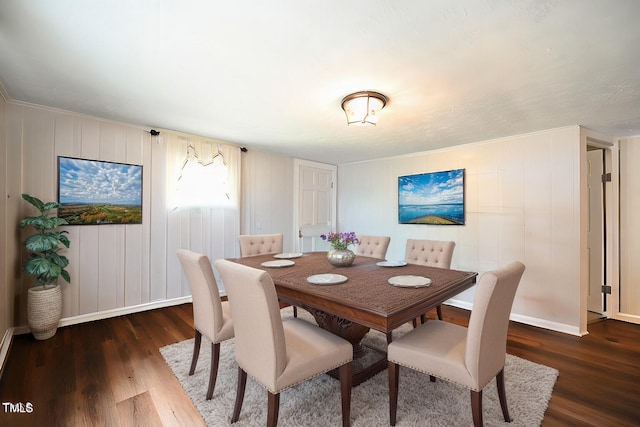 dining space with dark hardwood / wood-style flooring