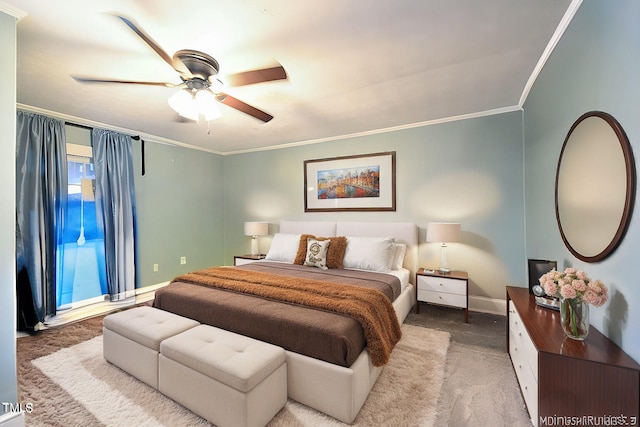 bedroom featuring crown molding, ceiling fan, and carpet floors