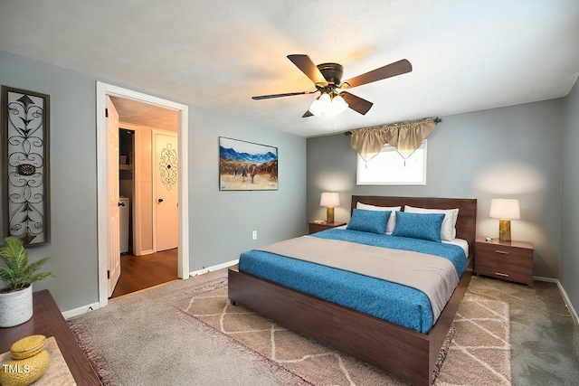 bedroom with dark colored carpet and ceiling fan