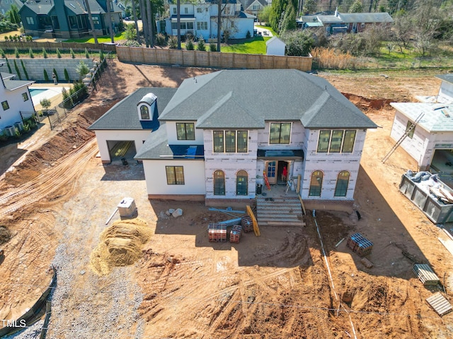 view of front of home with roof with shingles