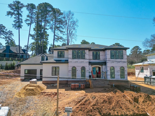 view of front of home featuring fence