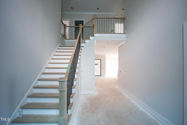 865 Wimbleton Dr, Raleigh, NC 27609 - stairs featuring a high ceiling, concrete flooring, and baseboards