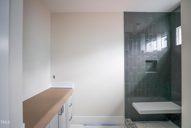 865 Wimbleton Dr, Raleigh, NC 27609 - full bathroom featuring tiled shower, vanity, and baseboards