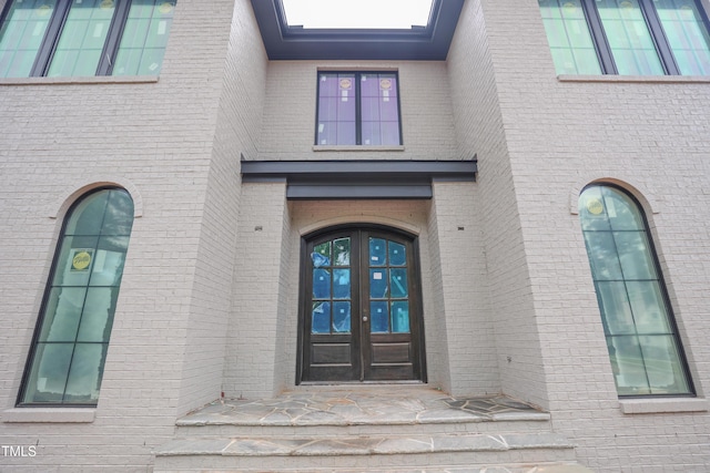 865 Wimbleton Dr, Raleigh, NC 27609 - property entrance with french doors and brick siding