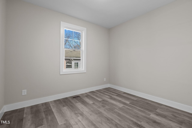 spare room featuring light hardwood / wood-style floors