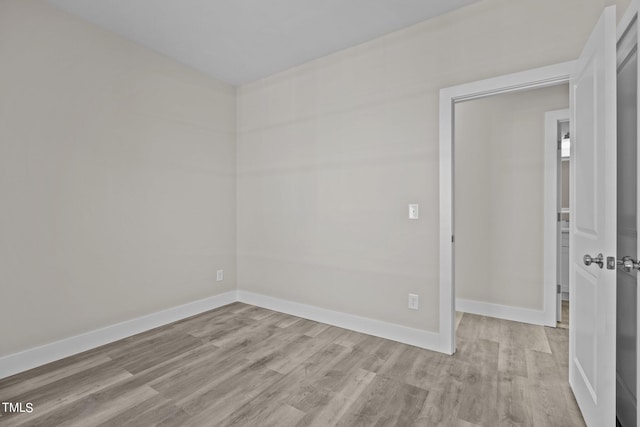 spare room with light hardwood / wood-style floors