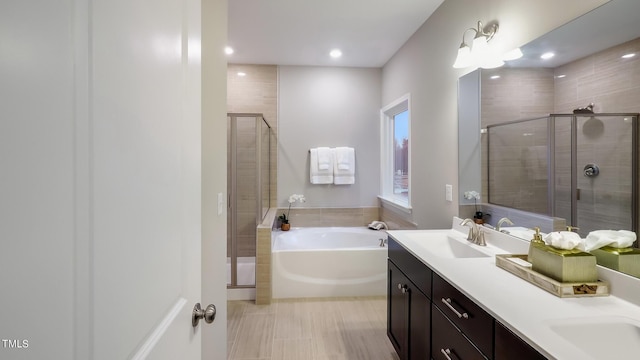 bathroom with vanity, plus walk in shower, and a chandelier