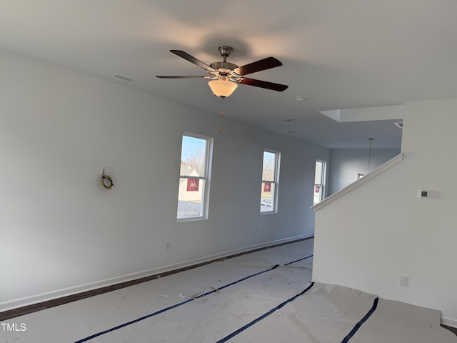 unfurnished room featuring ceiling fan