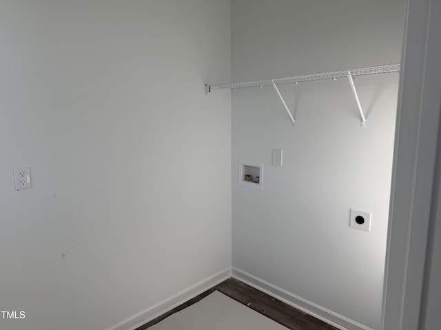 clothes washing area featuring laundry area, baseboards, dark wood-type flooring, washer hookup, and electric dryer hookup