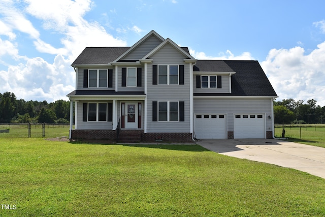 view of front of home featuring a front yard and a garage