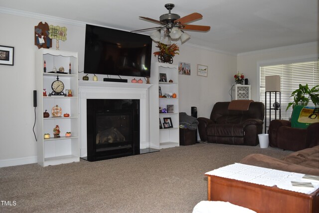 carpeted living room featuring crown molding and ceiling fan