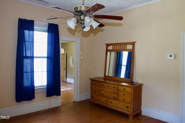 9358 Main St, Castalia, NC 27816 - bedroom featuring baseboards, wood finished floors, ceiling fan, and crown molding