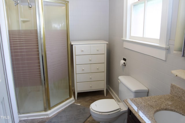 9358 Main St, Castalia, NC 27816 - bathroom with tile walls, a stall shower, toilet, and vanity