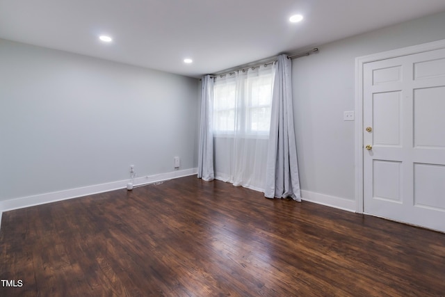 empty room featuring dark hardwood / wood-style floors