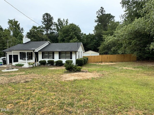 ranch-style house with a front lawn