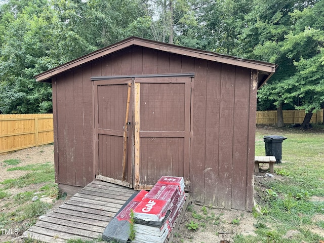 view of outbuilding with a lawn