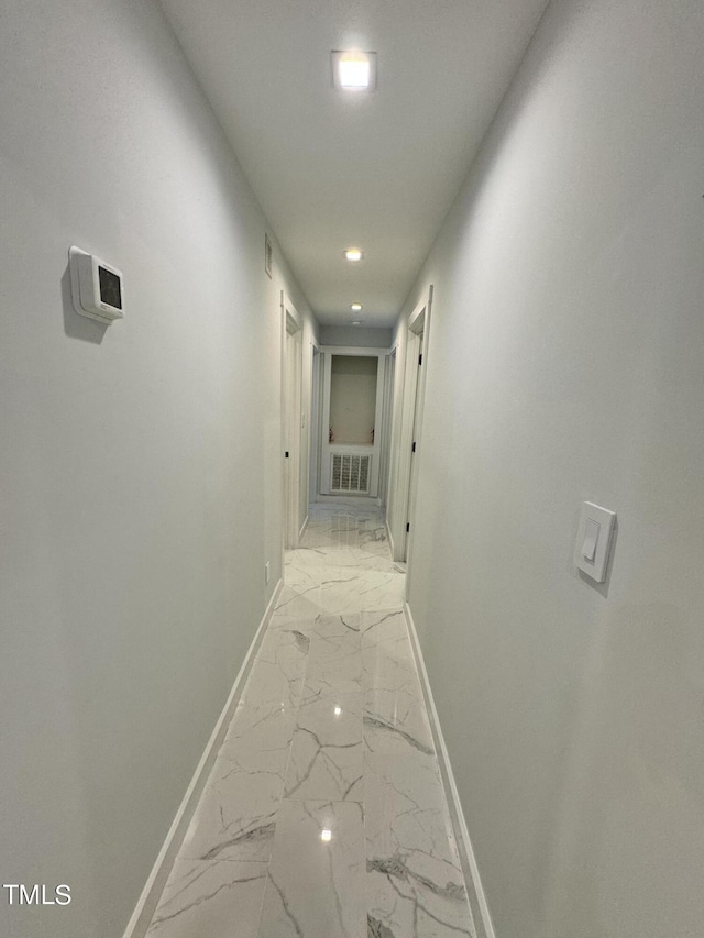 corridor featuring light tile patterned flooring