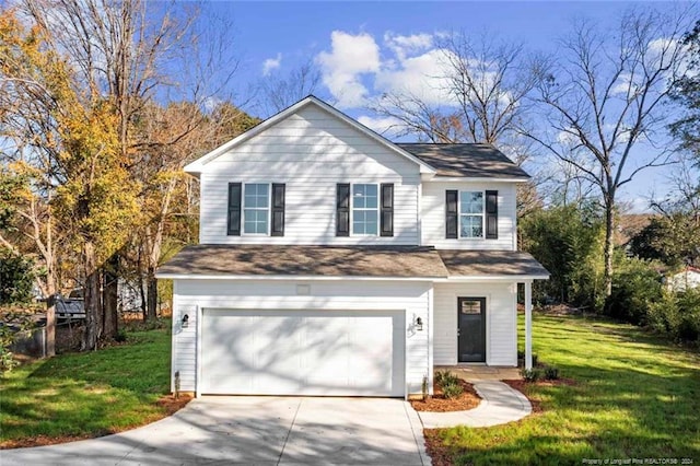 view of property featuring a front yard and a garage