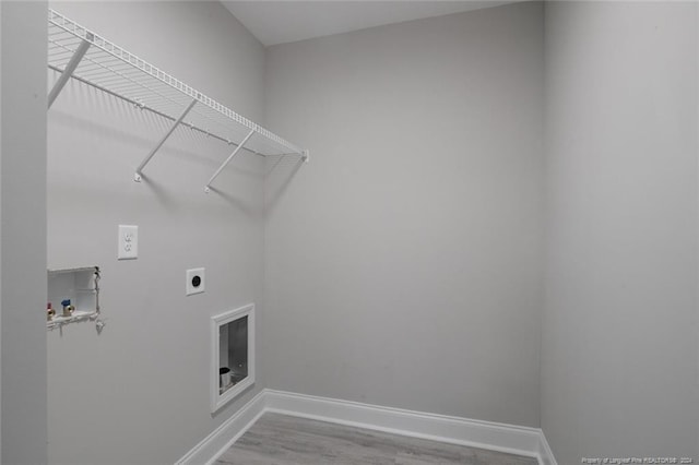 washroom with washer hookup, electric dryer hookup, and hardwood / wood-style floors