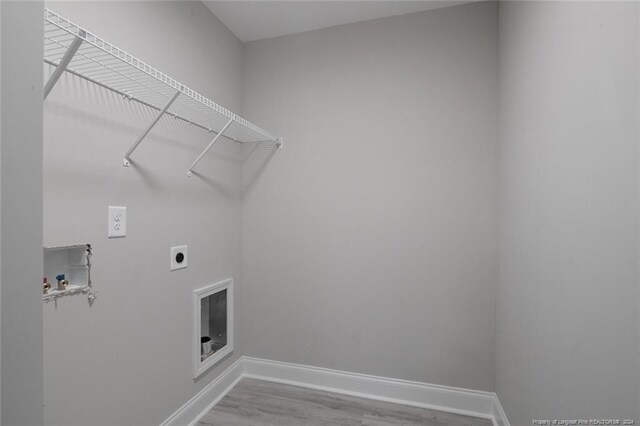 57 E Third St, Parkton, NC 28371 - laundry area featuring electric dryer hookup, hookup for a washing machine, and wood finished floors