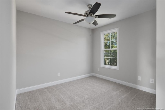 empty room featuring carpet and ceiling fan