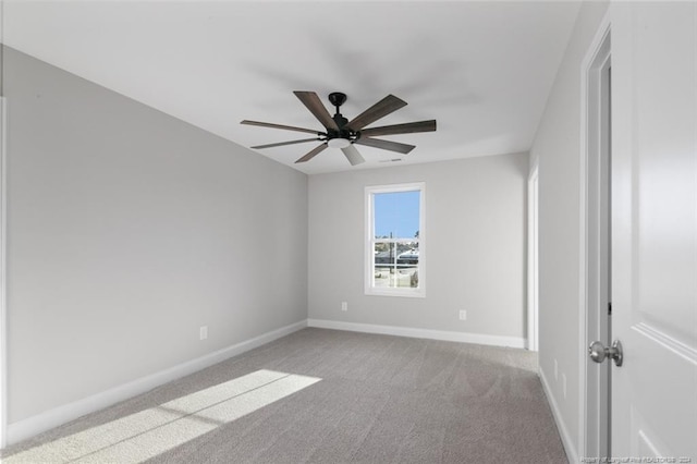 unfurnished room featuring light carpet and ceiling fan