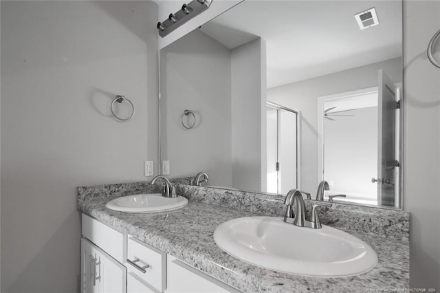 bathroom featuring vanity and ceiling fan