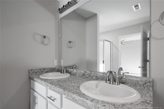 57 E Third St, Parkton, NC 28371 - bathroom with double vanity and a shower stall