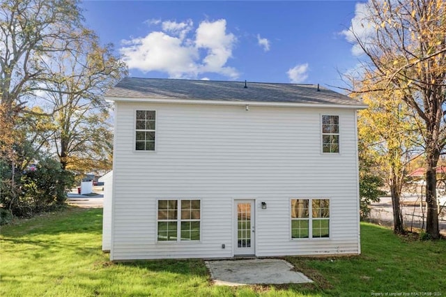 57 E Third St, Parkton, NC 28371 - rear view of property featuring a lawn