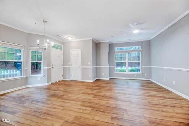 unfurnished living room with crown molding, light hardwood / wood-style flooring, and ceiling fan with notable chandelier