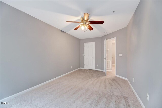 unfurnished bedroom featuring ceiling fan and carpet floors