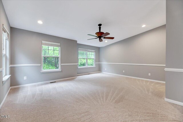 empty room with carpet flooring and ceiling fan