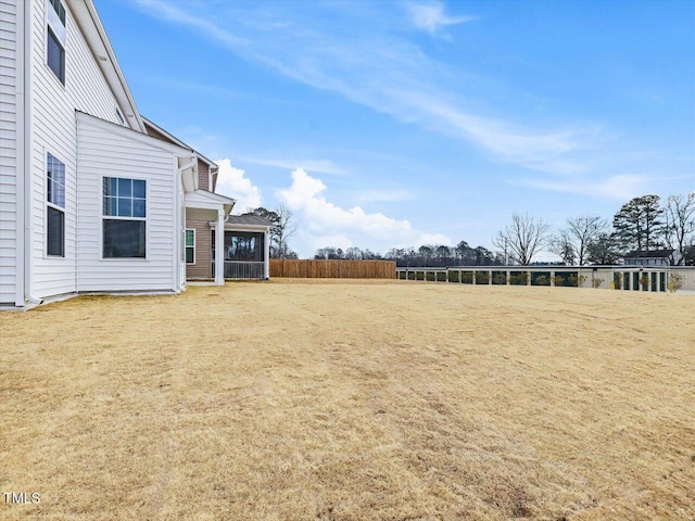 view of yard with a sunroom