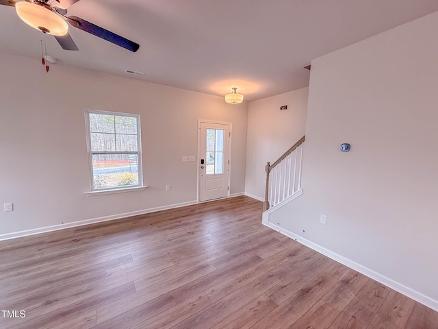 entrance foyer with ceiling fan and light hardwood / wood-style floors