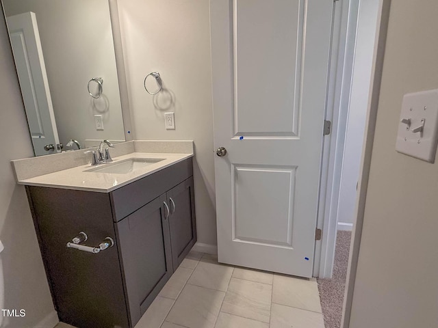 bathroom with tile patterned flooring and vanity