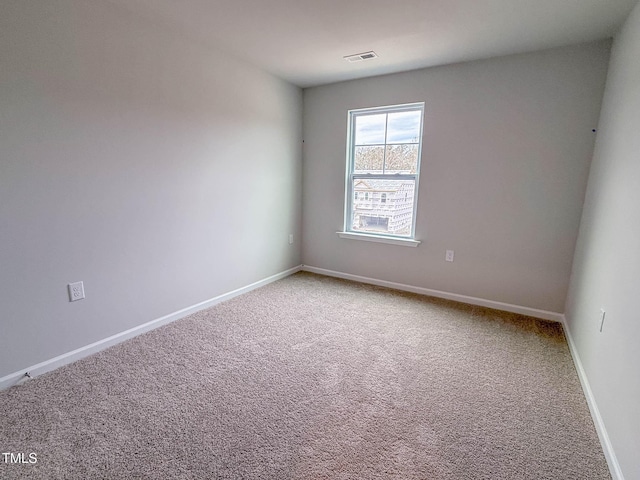 unfurnished room featuring carpet