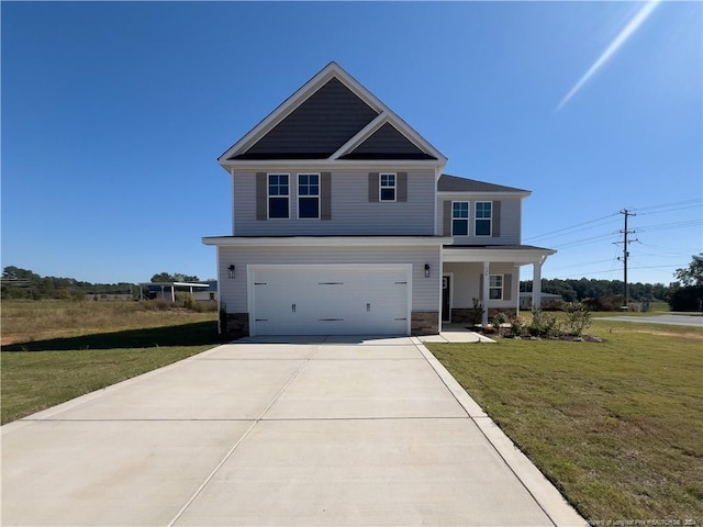 craftsman-style home featuring a front lawn and a garage