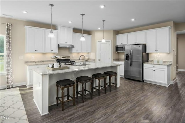 508 Impala Trce, Wendell, NC 27591 - kitchen featuring stainless steel appliances, a sink, baseboards, dark wood-type flooring, and under cabinet range hood