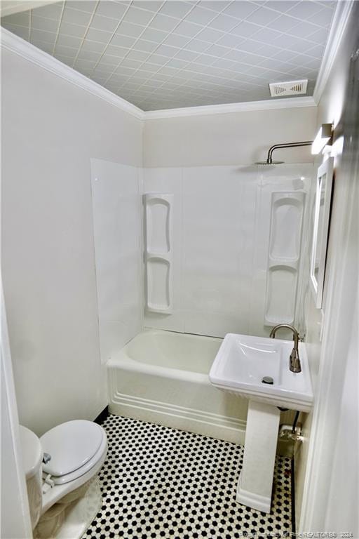 bathroom featuring crown molding, shower / bath combination, and toilet