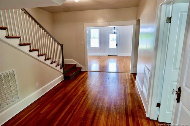 foyer entrance with dark hardwood / wood-style floors