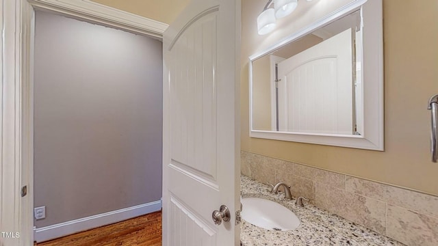 bathroom featuring vanity and hardwood / wood-style flooring