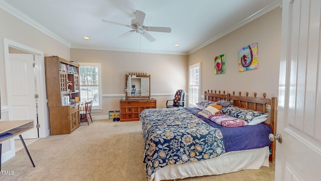 bedroom with light colored carpet, ceiling fan, and crown molding